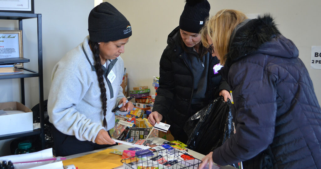 Volunteers sorting Gift cards for Hope for the Holidays