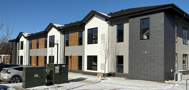 Exterior view of Hopes Portage CAP Agency residential building in winter with snow