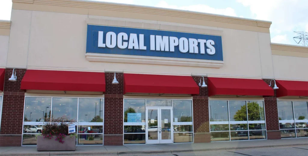 The exterior of the Local Imports Thrift Store building.
